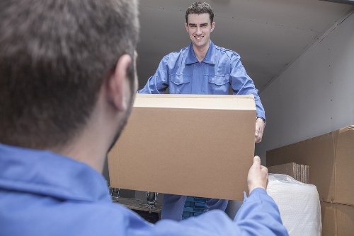 Professional office movers handling equipment