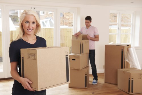 Professional movers handling furniture for pick-up