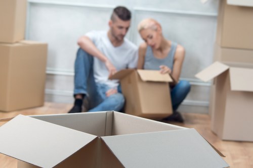 Professional movers packing items securely