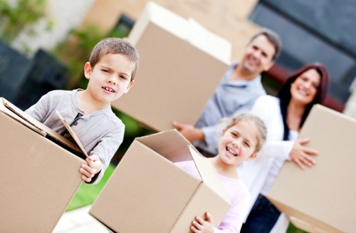 Volunteers receiving donated furniture from a removals company for charity reuse