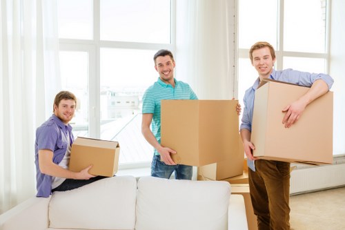 Efficient team loading furniture onto a removal truck