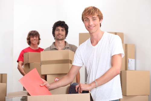 Experienced removal team handling office furniture during a move