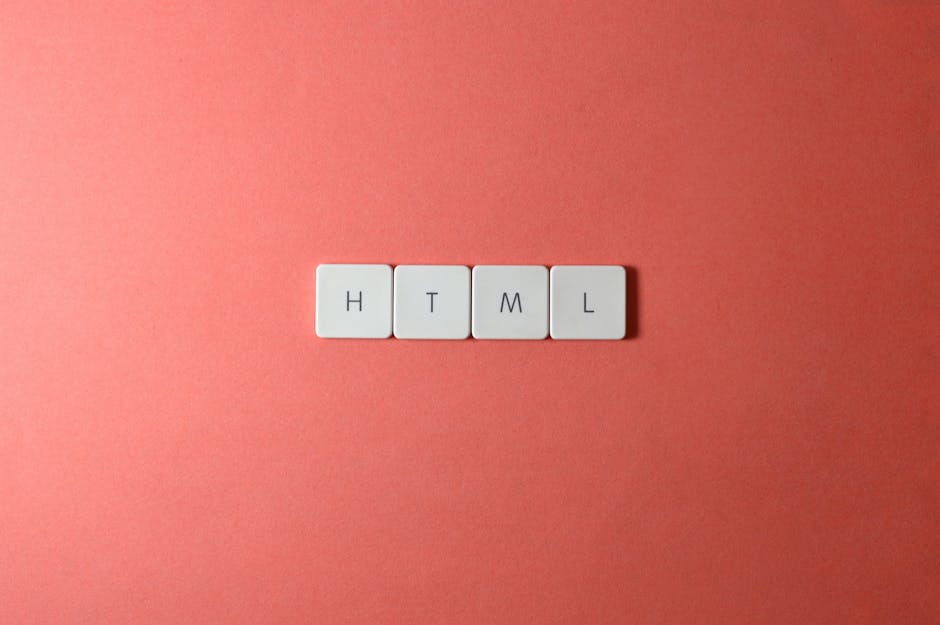 A person's hand with red nail polish is holding a small wooden sign with a string, hanging against a plain beige background. The sign displays the words 'PAY ZERO!' in bold, black capital letters. The